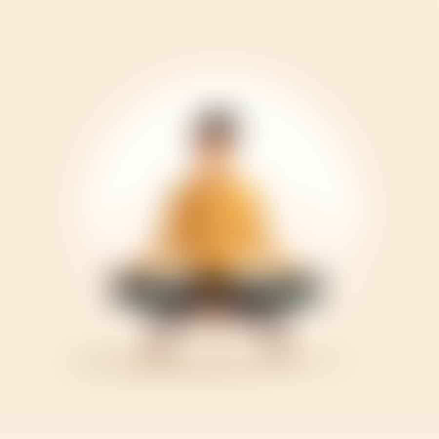 A person sitting properly on a meditation chair with their back straight and hands resting on their knees